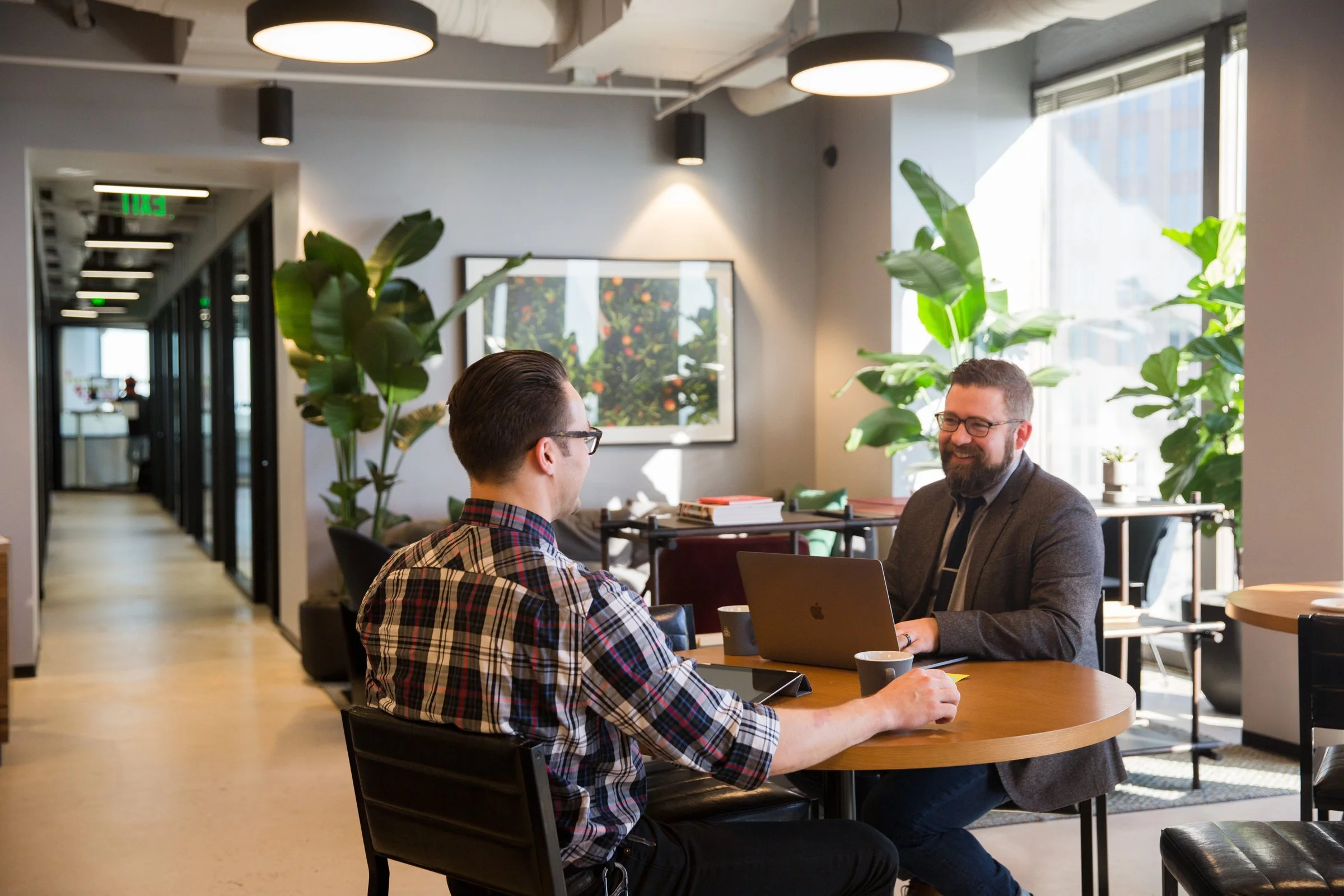 Atlas Solutions engineer meeting with a client at their office
